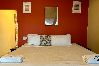 Rent by room in El Caimito - Villas Del Lago Resort – King Room | Upper Floor
